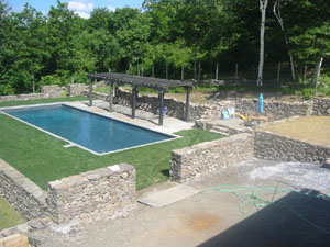 Stone Walls surround Pool area with Flagstone Patios